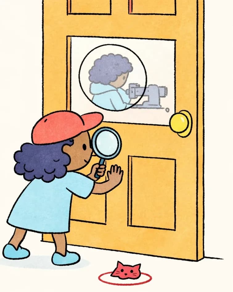 On the right side of the image, Alana stands facing a large wooden door, pressing one hand against it while holding a magnifying glass up to peer through a small circular window in the door. She is leaning forward curiously with her legs in a wide, eager stance, clearly trying to see what Mom is doing inside. Through the small round window, the blurry silhouette of Mom is faintly visible, hunched over her sewing machine. A small pink cat-face object sits on the floor near Alana's feet. The scene is indoors with a plain white background on the left.