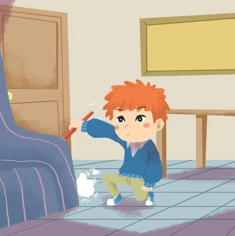 Boy crouching to sweep dust from under blue couch with dustpan