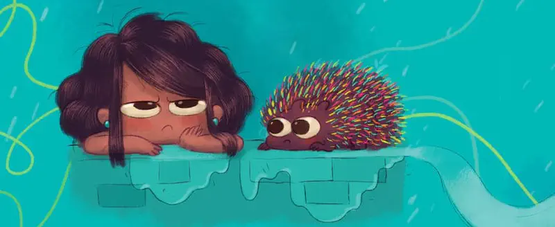 Boy and older dog walking together on path through autumn leaves