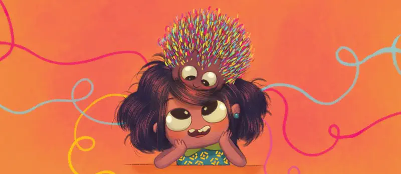 Boy feeding puppy from bowl while dog wags tail happily