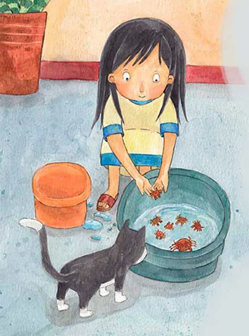 Girl putting crabs into green tub of water while black cat watches from behind
