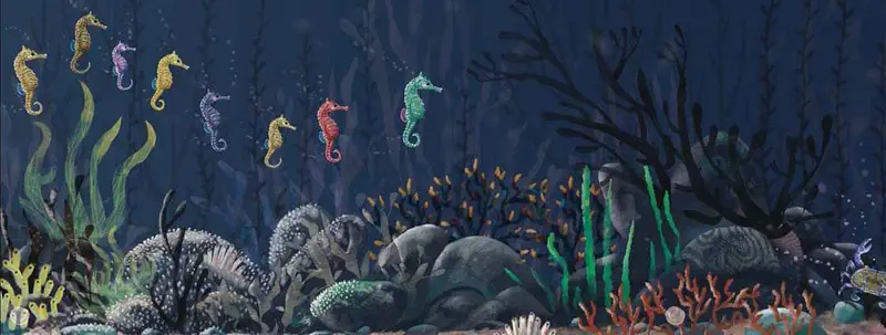 Row of colorful seahorses in yellow, purple, red, and turquoise swimming above dark ocean floor with seaweed.