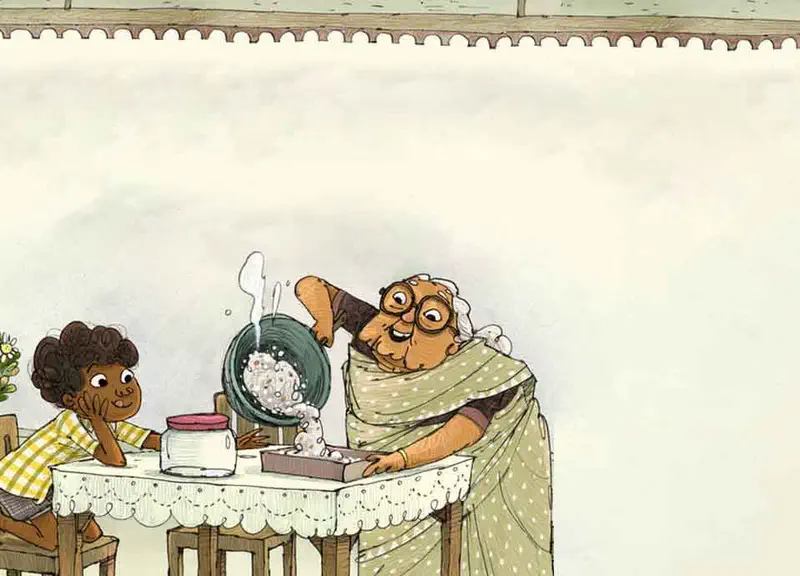 Grandmother pours coconut mixture from a pan into a baking tin on a table while the boy watches with his chin resting on his hand.