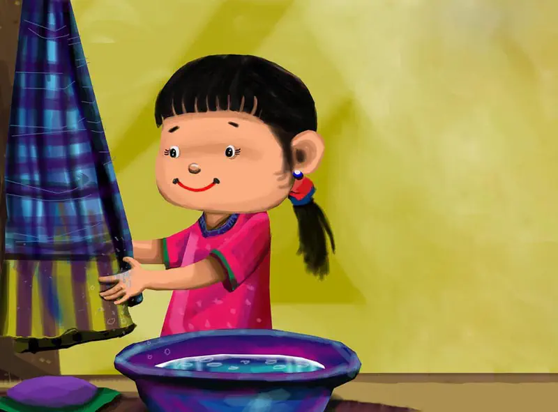 A smiling girl in a pink dress dries her hands with a blue striped towel near a basin of water.