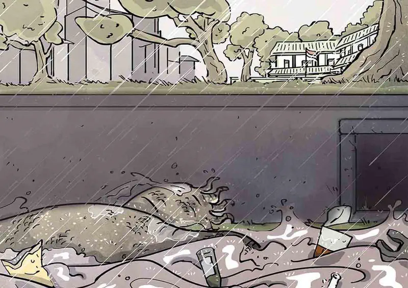 A monitor lizard lying in a flooded drain during heavy rain with a house and trees visible in the background.