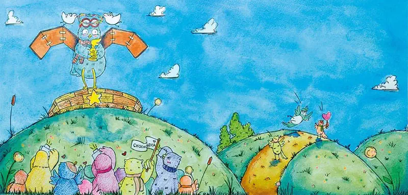 The blue owl stands triumphantly on a winner's podium holding a trophy, wearing cardboard wings as colorful bird fans cheer from the grassy hills below.