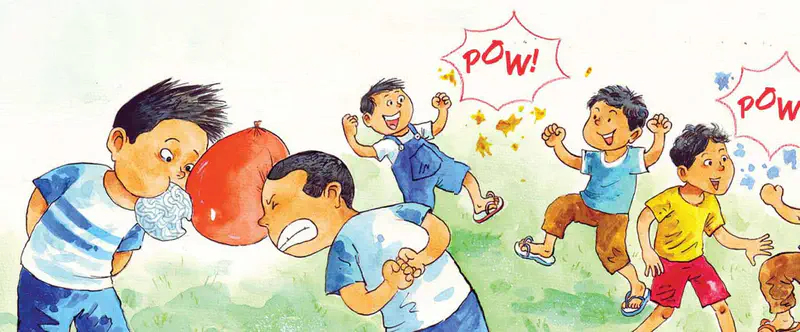 Boy blows up a red balloon while other children play and balloons pop with POW sound effects on a grassy field.