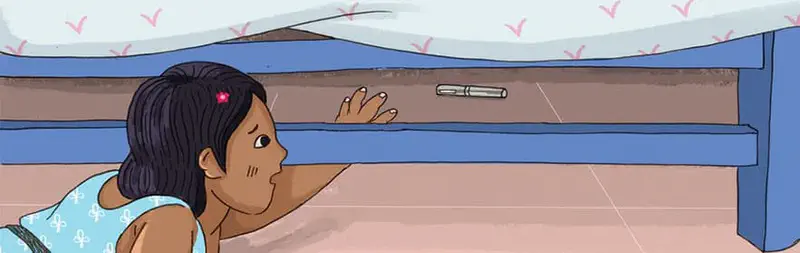 A worried girl reaches under a blue bed trying to grab a pen that rolled too far underneath. Pink bedding covers the mattress.