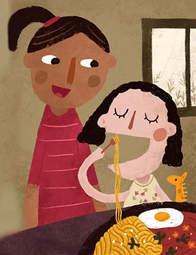 Older girl feeding noodles to younger curly-haired girl with toy giraffe at table with fried egg.