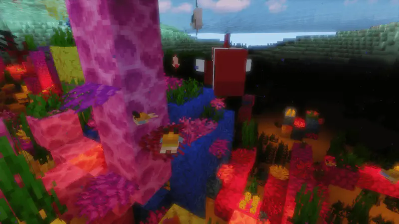 Colorful underwater Minecraft coral reef with pink, purple, blue and red coral formations and tropical fish.