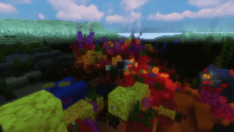 Underwater Minecraft view of colorful coral reef with sea pickles and various coral blocks.