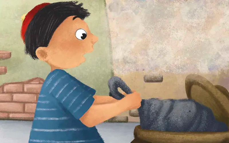 Boy in striped shirt holding tire near large barrel in cluttered outdoor area.