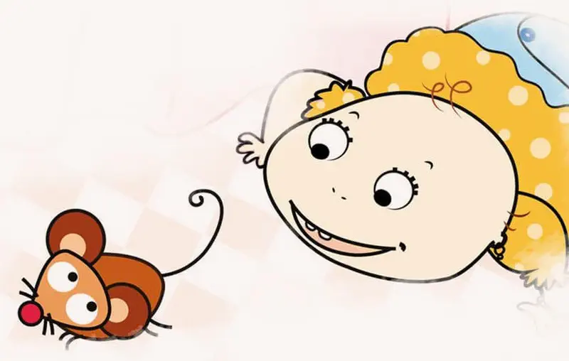 Smiling blonde girl in polka dot dress lying on floor looking at cute brown mouse.