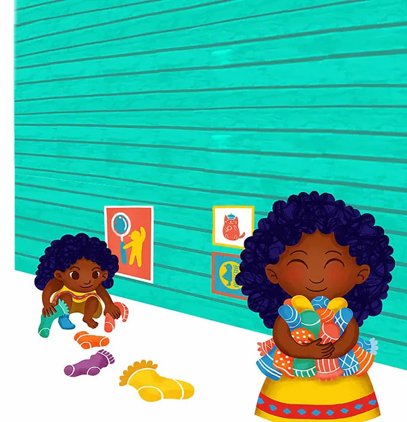 Baby playing with socks on floor while older girl hugs armful of colorful socks happily.