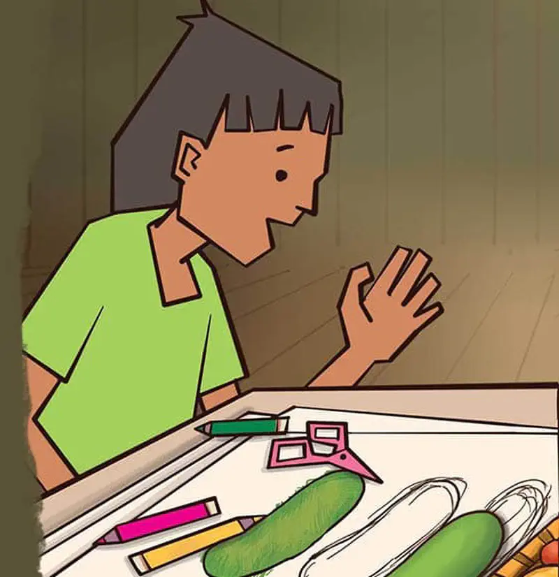 Boy looking at cucumber drawings on paper with colored pencils scattered on table.