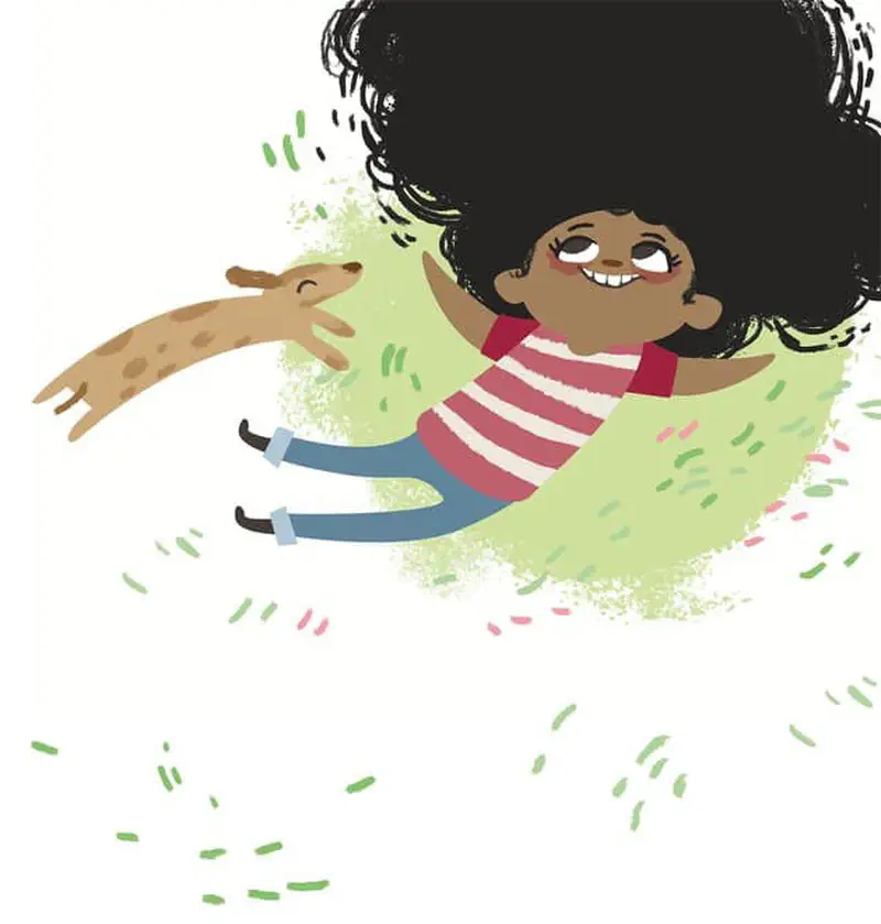 Happy girl sitting on grass with her dog, hair flowing with colorful confetti pieces.