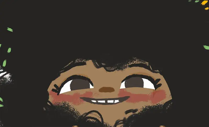 Close-up of smiling girl with big curly black hair decorated with colorful confetti pieces.