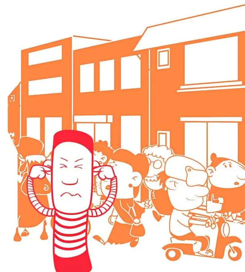 A boy in red covers his ears looking frustrated in a crowded orange street scene with many people and a scooter.