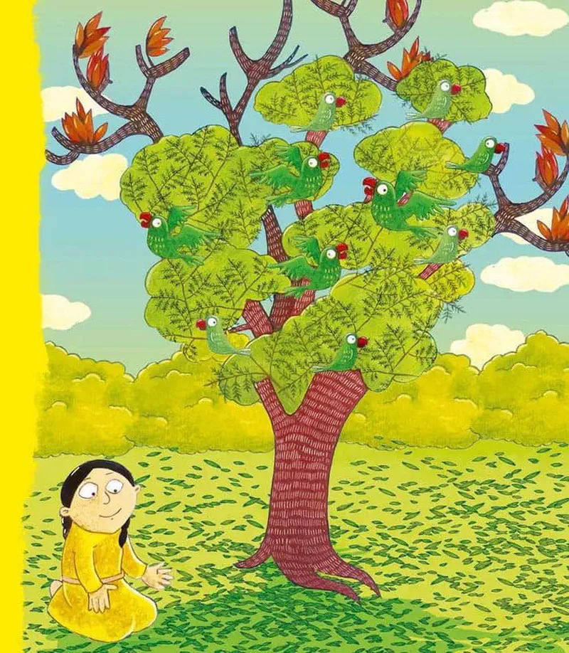 A girl sits under a tree looking up at many green parrots with red beaks perched among the branches and new spring leaves.