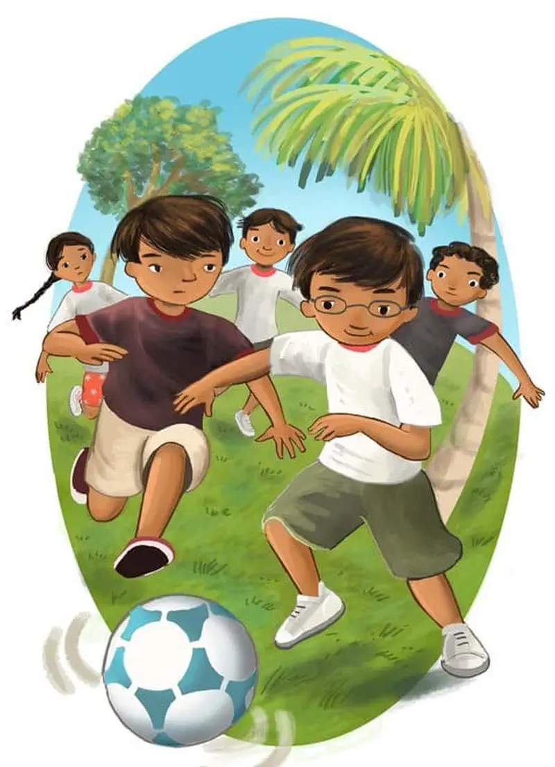 Two boys compete for a soccer ball on a grassy field, one in a maroon shirt and one with glasses in white, while teammates run behind them near palm trees.