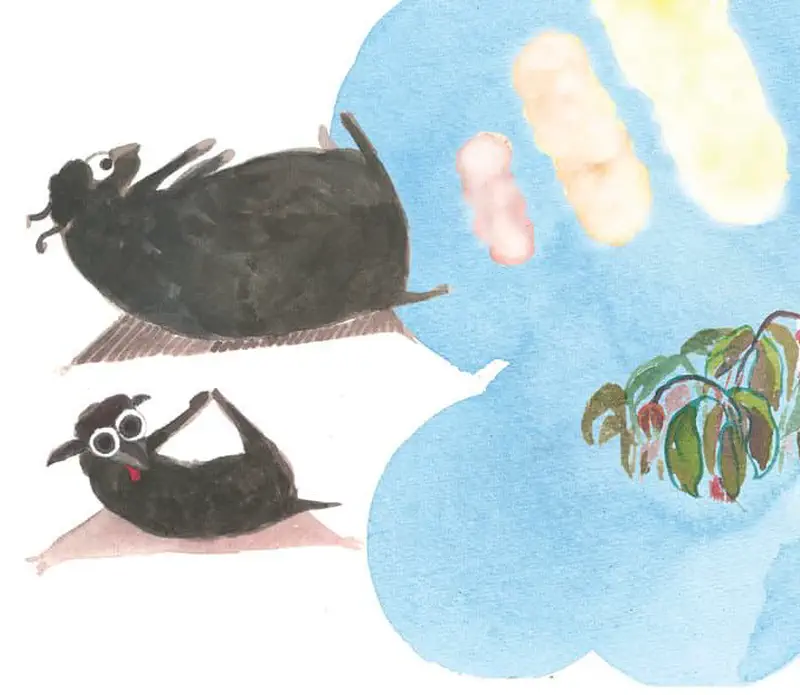 A black dog lies on its back playfully while dreaming of fruit hanging from a tree branch in a blue thought bubble.