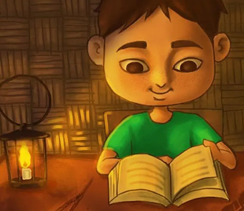 A boy in a green shirt reads an open book by lantern light inside a cozy woven bamboo room.