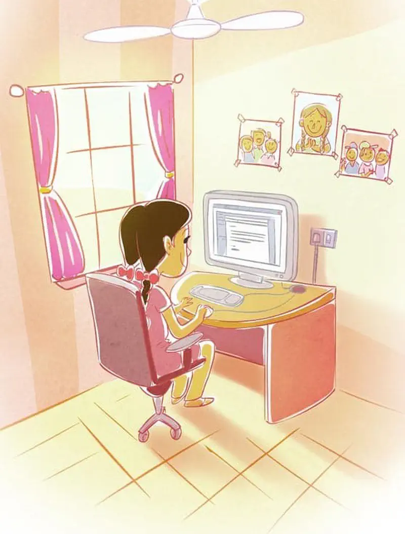 A girl with braided hair sits at a pink desk using a computer in her bedroom with family photos on the wall.