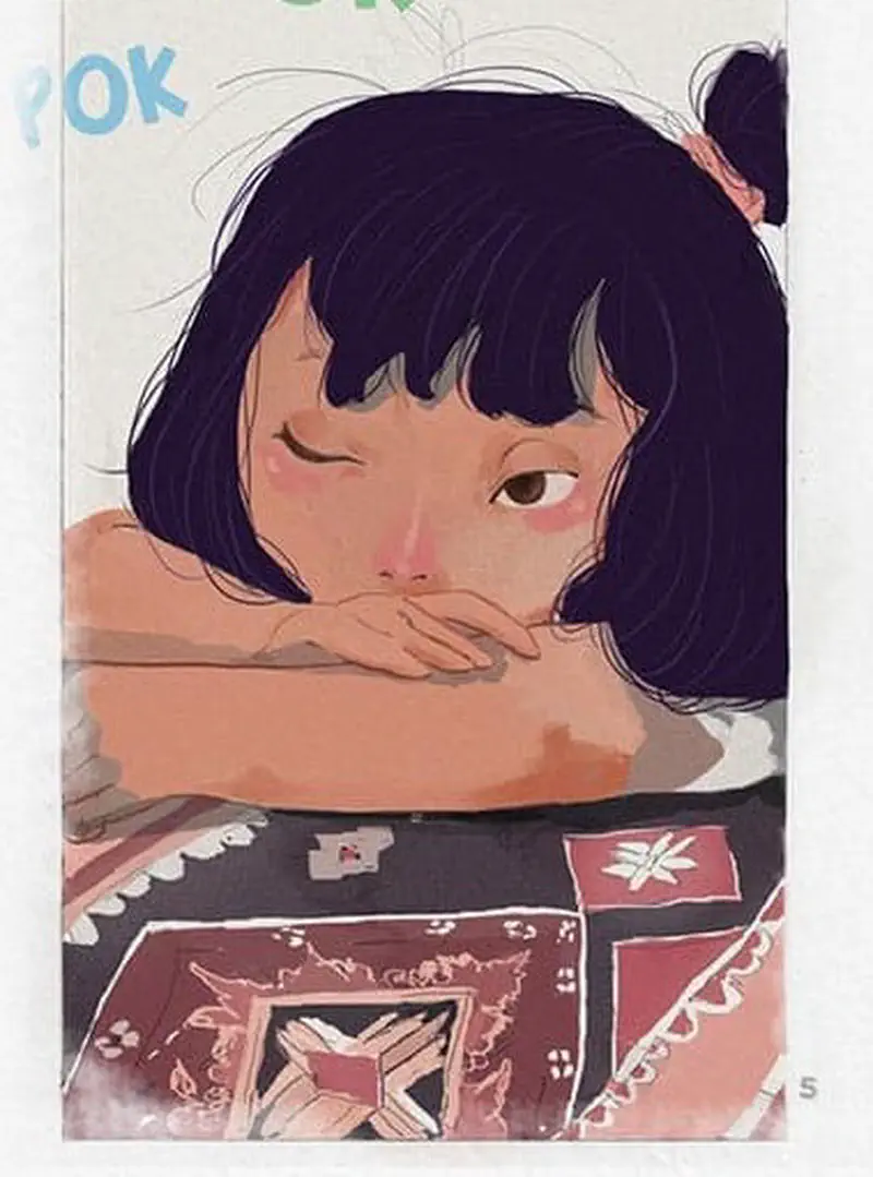 A young girl with dark hair rests her chin on her arms looking thoughtful while lying on a traditional woven textile.